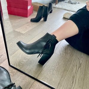 Wishbone leather booties with fringe detail